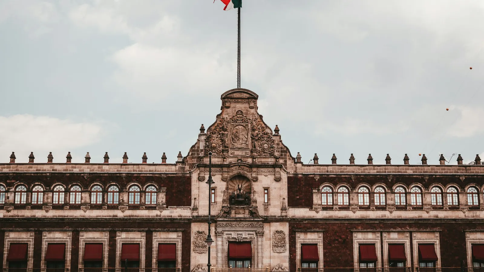Palacio Nacional in Mexico City at dusk, SAT tax assessment guide