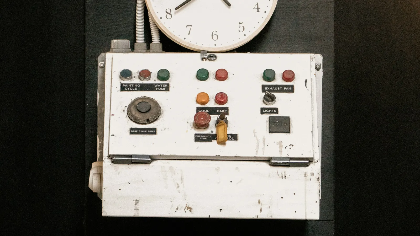 Old industrial control panel with a wall clock, employee lawsuit against a company in Mexico